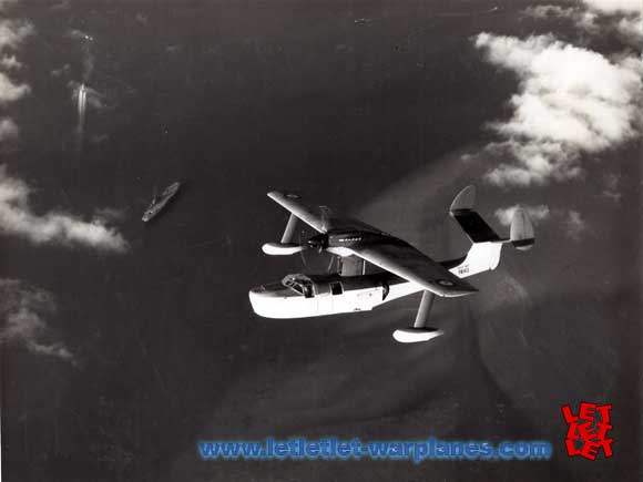 The twin-fin PA 143 flying above the sea. Note the aircraft carrier on the left side!