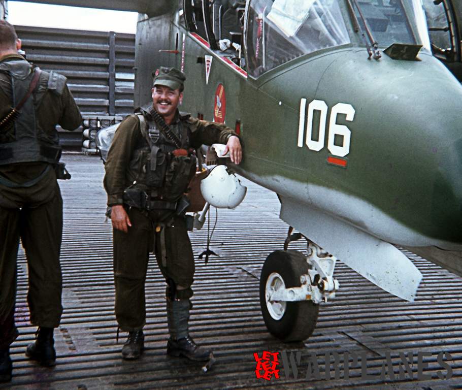 Dan Sheehan standing next to 106 in Binh Thuy after a mission.
