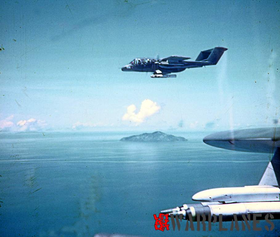 OV-10A Bronco no. 106 in a combat wing position just off-shore from Rach Gia, RVN. There is a 2-rail Zuni launcher under each wing.  The wing rockets were usually proximity fused.  This flight expended ordinance and the wing rockets were all fired. 