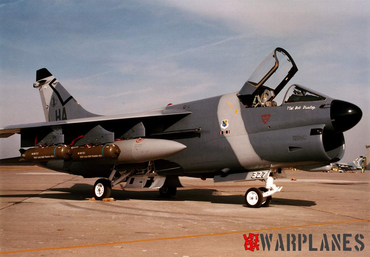 Iowa National Guard A-7D on ground, new type camouflage and reduced visibility markings are obvious and under wing are practice bombs.